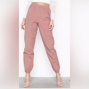 Nylon '80s Jogger from Missguided Loose-fit design. Elastic waist hemsThin text